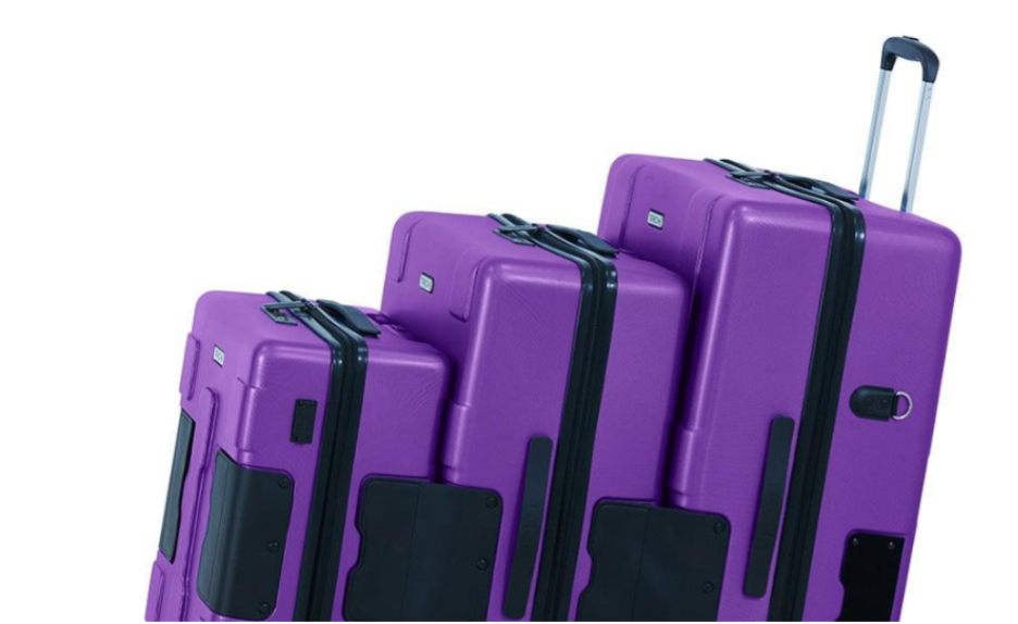 Close-up of purple TACH hard-side luggage set showing three connected sizes. 